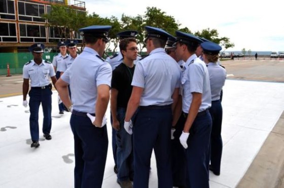 stepdad leadership - a new doolie is surrounded by upperclassmen providing the doolie with "guidance".