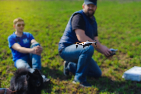 bonding with your stepkids - stepdad and stepson playing with remote control drone