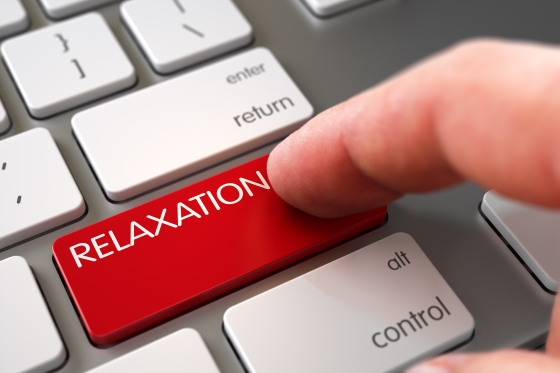 eight life changing relaxation tips - man pressing RELAXATION key on keyboard