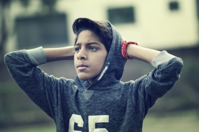 staying close to your teenage son - picture of a teenage boy in contemplation