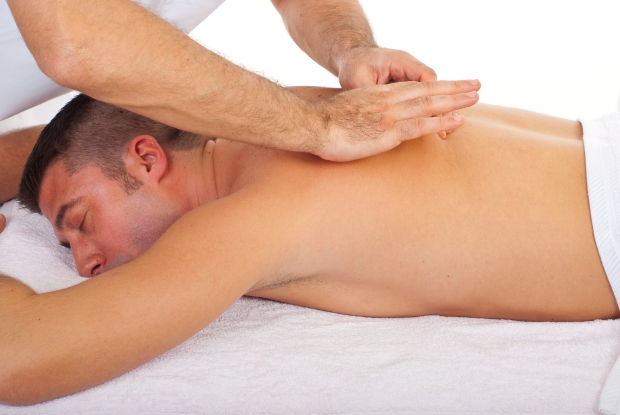 dads need massage therapy -man receiving back massage