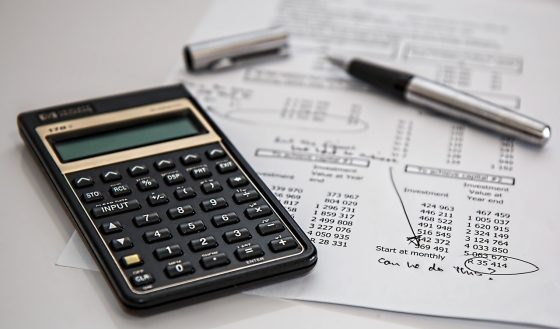 must things to know about writing a will - picture of calculator and figures