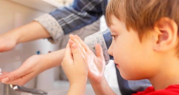 Teaching young children about hygiene-a boy washing his hands
