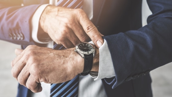 tips when buying a gift for that special someone - Man checking time on his watch