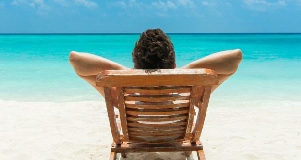 Ways to help prevent sunburn- A man sunbathing