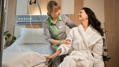 Patient transfer aids- a carer helping a patient into bed