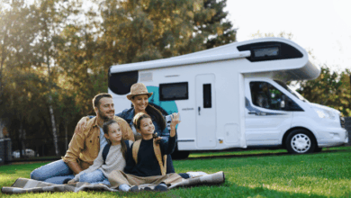 Importance of buying from trusted caravan dealers - a happy family in front of a caravan
