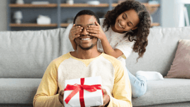 How To Choose The Perfect Father's Day Gift - daughter giving dad a surprise gift