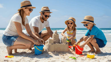 Love language of quality time -A joyful stepfamily spending quality time together at the beach, building a sandcastle in the sunshine.