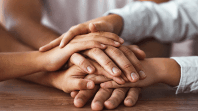 Places To Find Support As A Blended Family - multiple hands resting on each other symbolizing care, support and unity