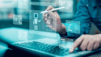 Game-Changing Tech Trends- close-up of a person's hand holding a stylus interacting with a touchscreen