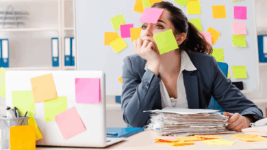 National Workaholics Day - Women with paperwork and post it