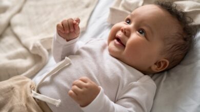 keeping your baby comfy in the crib-Happy cute baby girl lying on comfortable crib.