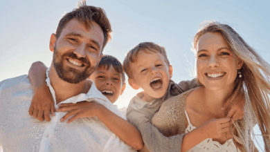 National Stepfamily Day- A happy stepfamily smiling into the camera