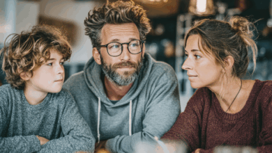 how to talk to kids about school shootings-Family discussing serious topic at dinner table