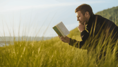 Stepdad selfcare- Stepdad reading book along the lake shore