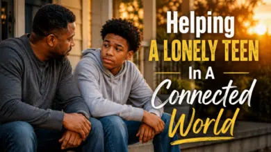 An-African-American-stepdad-sitting-beside-a-teenage-son-or-daughter-on-a-front-porch-at-sunset.